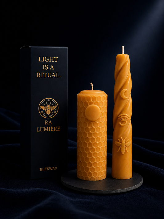 Ra Lumière Ritual Pair featuring handcrafted beeswax candles with luxury gift packaging in midnight blue and gold