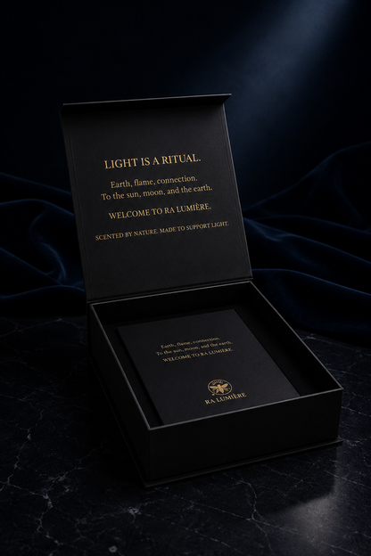 Ra Lumière luxury gift box with premium candle packaging and ritual card in midnight blue and gold