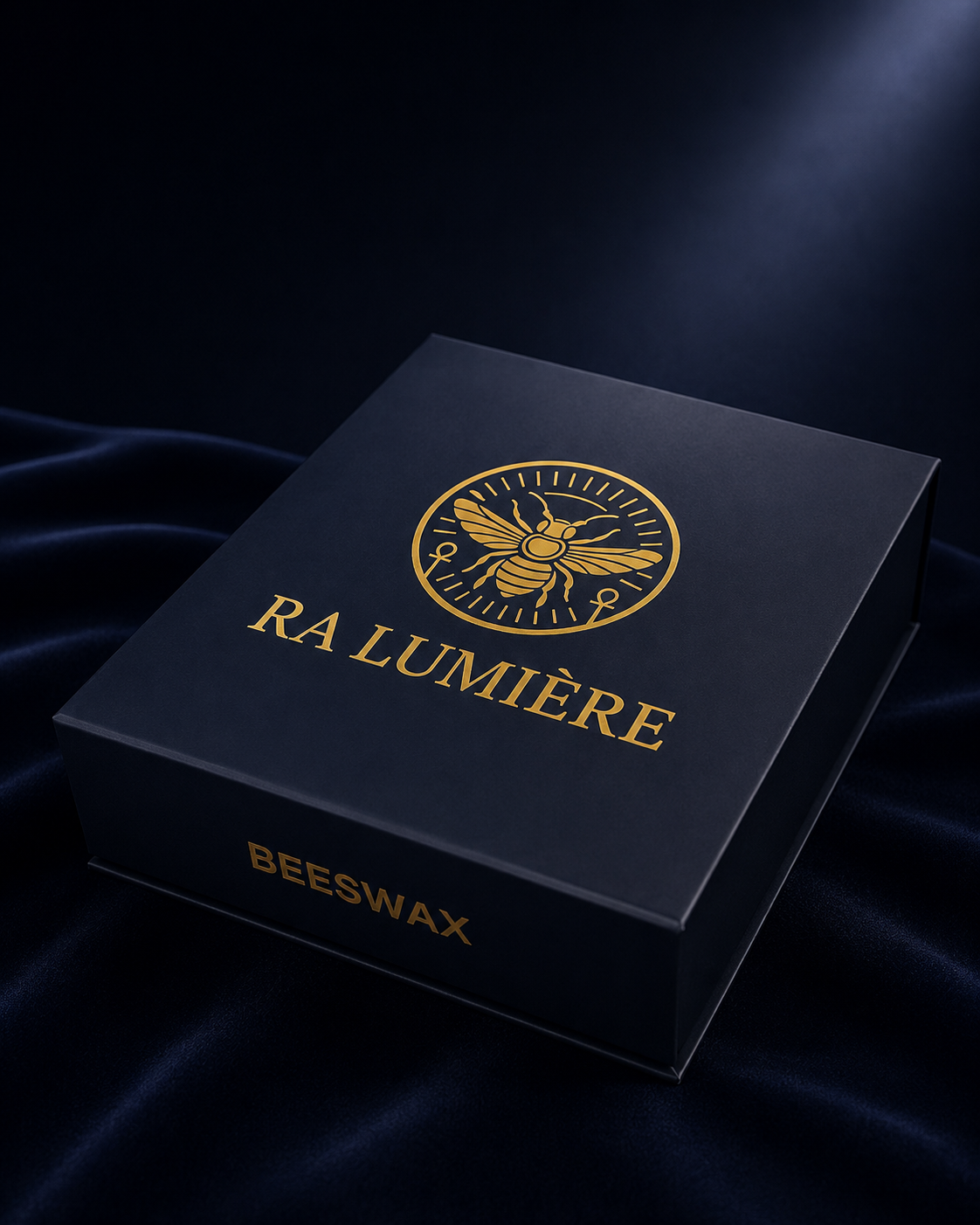 Ra Lumière luxury beeswax candle gift box in midnight blue with gold foil bee emblem